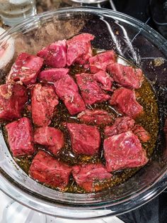 meat is being cooked in a glass bowl