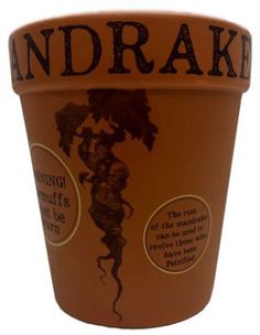 a brown and black cup with writing on the bottom that says andrake in english