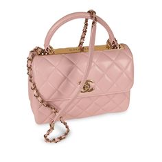 Oozing allure and sophistication, Chanel presents one of its most ravishing, highly acclaimed handbags, the Chanel Trendy CC Flap in Small. Crafted from light pink with lilac tones lambskin, the handbag features a sporty yet sharp silhouette. Its exterior is adorned in champagne gold hardware with a rather enlarged CC clasp and Chanel’s signature chain strap. Ideal for the lady who bears an adoration for Chanel handbags but wants to steer away from the classic collection without compromising on aesthetic, the Trendy CC flap can be both during the day and night. SPL Exterior Light pink with lilac tones lambskin leather Champagne Gold toned hardware Signature CC clasp Chanel logo cut-out handle plaque Turn-lock closure Interwoven leather and chain strap Reinforced top handle Slip pocket on r Chanel Trendy Cc, Champagne Gold Hardware, Chanel Logo, Champagne Gold, Classic Collection, Exclusive Bag, Chanel Handbags, Flap Bag, Pink Leather