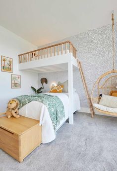 a child's bedroom with a swing bed and hanging chair in front of it