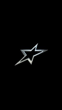 a black background with a silver star on it