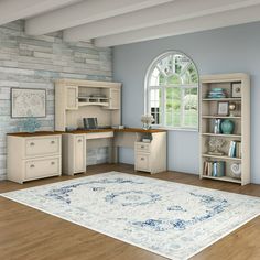 a living room filled with furniture and a large rug