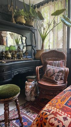 a living room filled with furniture and lots of plants