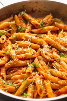 pasta with tomato sauce and parmesan cheese in a pan