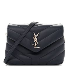 This is an authentic SAINT LAURENT Calfskin Y Quilted Monogram Toy Loulou Chain Satchel in Medium Blue. This elegant shoulder bag is crafted of chic chevron quilted calfskin leather in dark blue. The bag features a leather shoulder strap and silver hardware. The frontal flap features a prominent silver tone YSL and opens to a partitioned black fabric interior with card slots, a zipper and patch pockets. This is an ideal bag for your collection for day or evening, with the classic chic only from Yves Saint Laurent! Chevron Quilt, Classic Chic, Silver Hardware, Black Fabric, Medium Blue, Patch Pocket, Card Slots, Yves Saint Laurent, Calf Skin