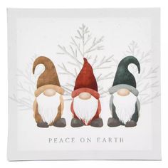 three gnomes sitting on top of each other with the words peace on earth above them