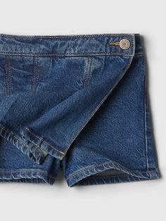 This style is made with 5% recycled cotton. Compared to virgin materials, using recycled materials helps to reduce resource use and waste. This product is part of our Washwell program, which uses at least 20% less water as compared with conventional wash methods. We’ve saved over a billion liters of water through Washwell since 2016. Low-stretch denim. Medium indigo wash. Snap closure (sizes 2T-5T have hook & bar closure and zip fly). Pleated at front. Patch pockets at back. Interior shorts. #532826 Pleated Denim, Denim Skort, Baby Gap, Toddler Dress, Recycled Cotton, Recycled Materials, Stretch Denim, Snap Closure, Jumpsuit Dress