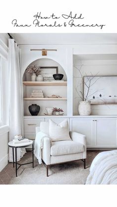 a white chair sitting in front of a book shelf filled with books and vases