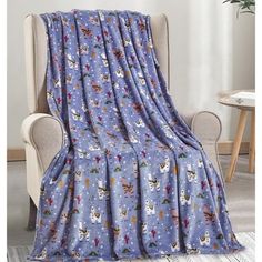 a blue blanket sitting on top of a chair