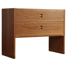 a wooden desk with two drawers on one side and an open drawer on the other