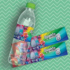 three bottles of toothpaste on a green and white chevron background