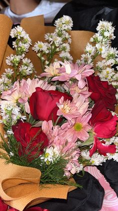 a bouquet of flowers sitting on top of a table