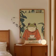 a frog sitting on top of a wooden cabinet next to a bed