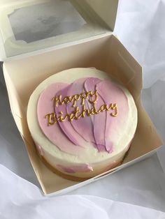 a birthday cake in a box with the words happy birthday written on it's frosting