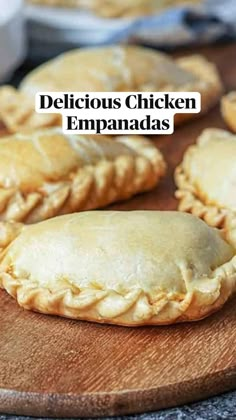 delicious chicken empanadas on a cutting board with the words delicious chicken empanadas