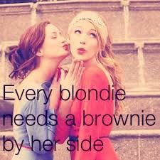 two girls with their faces close to each other and the words, every blonde needs a brownie by her side