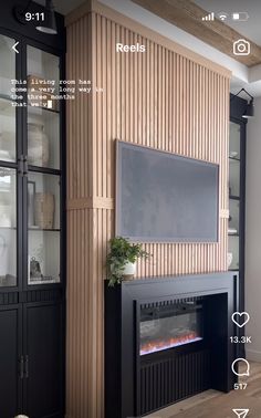 a living room with a fireplace and entertainment center