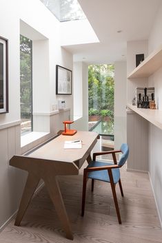 a modern home office with skylights above the desk