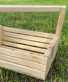 a wooden bench sitting in the grass