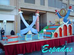 an elaborately decorated float in front of a building