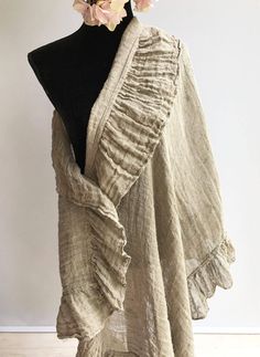 "This is a fantastic, generously sized linen shawl with an elegant ruffle along all sides. Made from gauzy, 100% pure natural taupe linen. Gorgeous texture and distinct wrinkling. Rustic texture combined with feminine styling. A great accessory that will prove itself a timeless value. The dimensions approximately 87\" x 31.5\" (220cm x 80 cm) The shawl will be pre-washed and won't shrink anymore. Care instructions: - machine washable in gentle wash cycle - preferably lukewarm water - straighten Bohemian Linen Shawl, Bohemian Linen Shawl Scarf, Shawl Wedding, Linen Scarf, Rustic Texture, Linen Scarves, Wedding Shawl, Women Shawl, Long Scarf