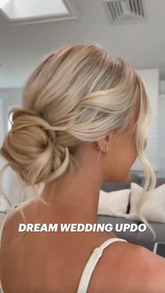 a woman with blonde hair in a wedding updo