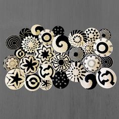 a bunch of black and white circles on a gray background with one circle in the middle