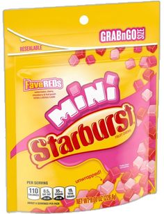 a bag of starbursts with pink cubes on it's side