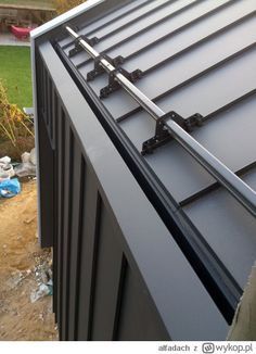 a metal roof that has been installed to the side of a house