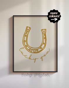 an image of a wall hanging with a horse shoe on it's side and the words more colours added