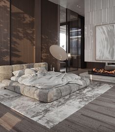 a modern living room with a large bed and fireplace in the center, surrounded by wood flooring