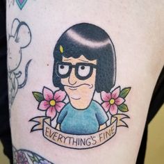 a cartoon character with glasses and flowers on her thigh is featured in this tattoo design