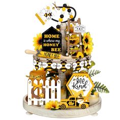 a cake with sunflowers, bees and honeycombs on it's stand