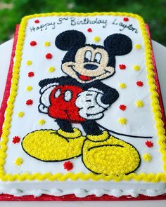 a birthday cake with a mickey mouse on it