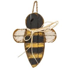 a wooden bee ornament hanging from a string on a white background with a yellow and black stripe