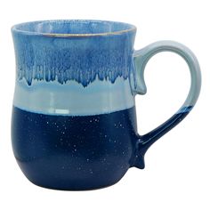 a blue and white coffee mug on a white background with water droplets in the bottom