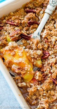 a casserole dish filled with fruit and nuts