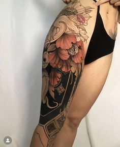 a woman with a tattoo on her thigh