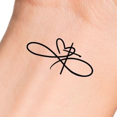 a person's wrist with a tattoo on it that has an infinite knot in the middle