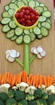 vegetables and fruits arranged in the shape of a flower