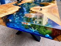 a table that has been made to look like an ocean scene with fish in the water