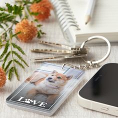 a key chain with a photo of a dog on it