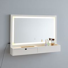 Ready, set, glam! Stash your beauty basics in this all-in-one wall vanity, so you can get glam on a moment's notice. Wall Mount Vanity Makeup, Makeup Mirror With Storage, Vanity Mirror On Wall, Wall Mount Makeup Vanity, Led Bathroom Mirror With Storage, Wall Vanity Floating Makeup, Wall Mounted Vanity Bedroom, Floating Make Up Vanity, Wall Makeup Storage