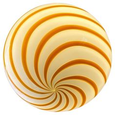 an orange and white striped glass ball on a white background, with the top section spinning outward