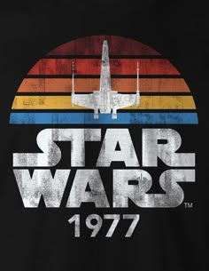 a star wars t - shirt with an airplane on the front and rainbows in the back