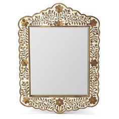 an ornate mirror with gold trimmings and flowers on the border, against a white background