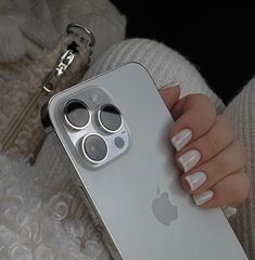 a woman's hand holding an apple phone case