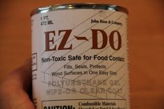 a can of ez - do sits in someone's hand