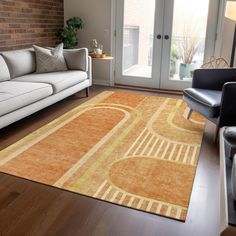 a living room with couches and a rug on the floor