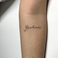 a woman's arm with the word yesha written in cursive writing